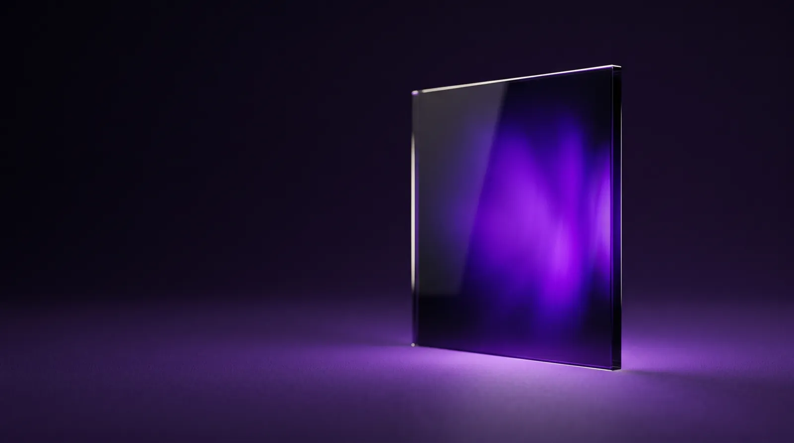 A dark glass pane standing upright, violet light coming on inside it — a screen waking up.