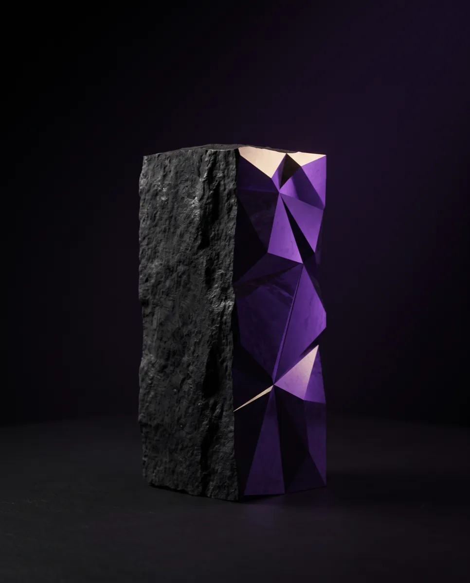 The same block half-machined: rough on one side, precise facets on the other.
