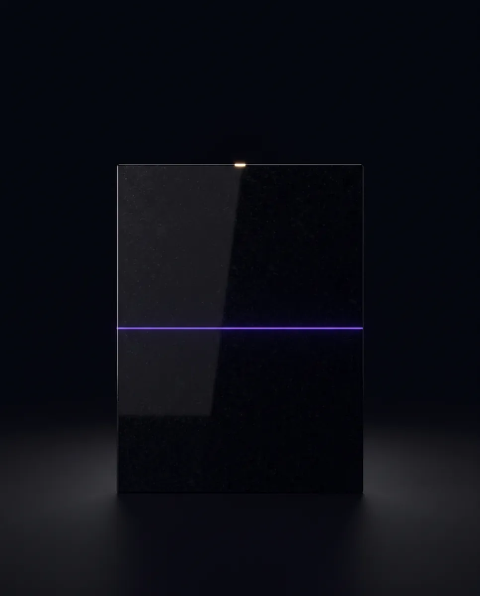 The finished slab, one straight violet line of light across its face like a measurement.
